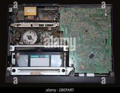 Internal View VHS video cassette recorder, vcr or video cassette player, vcp with loaded video tape. Round Video head can also be seen Stock Photo