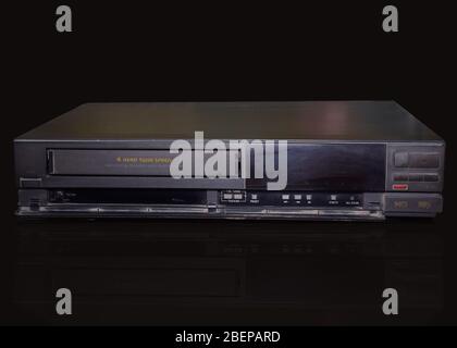 Rare Vintage Old Video Cassette Recorder or VCR isolated on a black background Stock Photo