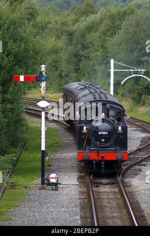 Ramsbottom, Lancashire, UK / August 24 2008: Steam locomotive approaching a station on a vintage railway Stock Photo