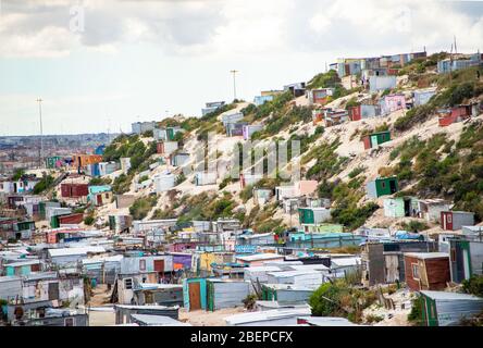 A view of the township called Khayelitsha on the outskirts of Cape Town, South Africa. The shacks sit on sandy soil and hillsides. It is one of the biggest townships in Africa. Stock Photo