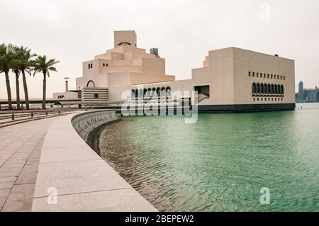 The Museum of Islamic Art seen from the surrounding park area jutting out into the Persian Gulf, Doha, Qatar.
