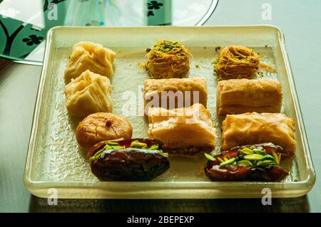 A glass plate of baklava on a table in a hotel room in Doha, Qatar. Stock Photo