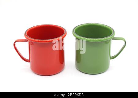 Enameled mugs, isolated on a white background Stock Photo