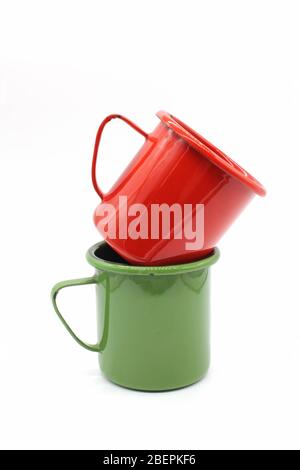 Enameled mugs, isolated on a white background Stock Photo