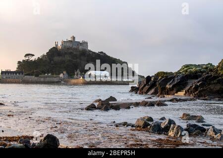 Early morning on the beach at Marazion, looking towards St Michael's Mount in Cornwall England UK