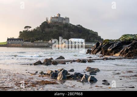 Early morning on the beach at Marazion, looking towards St Michael's Mount in Cornwall England UK