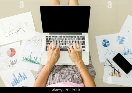 Women working on laptop computers and business documents. Working at home concept. Stock Photo