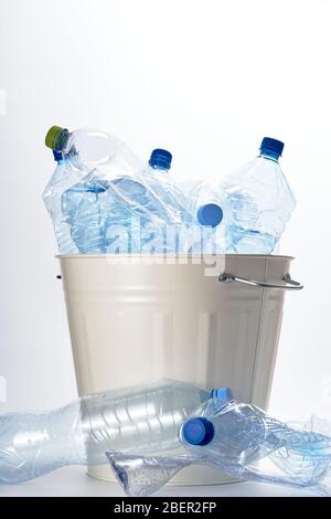 empty plastic water bottles thrown into the trash. The problem of recycling and recycling Stock Photo