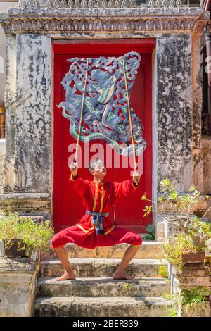 Ratchaburi, Thailand - November 04, 2018: NangYai shadow play on Ramayana epic, Thai traditional performance playing with the carved cow's skin with d Stock Photo