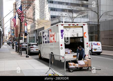 FedEx truck working during coronavirus pandemic, New York City. Stock Photo