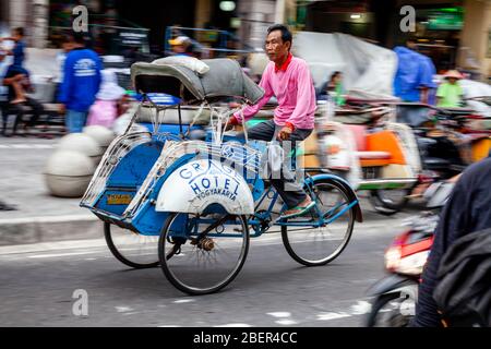 A Traditional Becak (Cycle Rickshaw) In Malioboro Street, Yogyakarta, Indonesia. Stock Photo