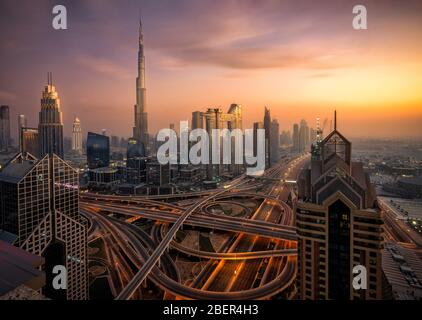 Dubai Skyline from hotel at blue hour sunset. Skycrapers can be seen as Burj Khalifa and Sheikh Zayed Road. Stock Photo