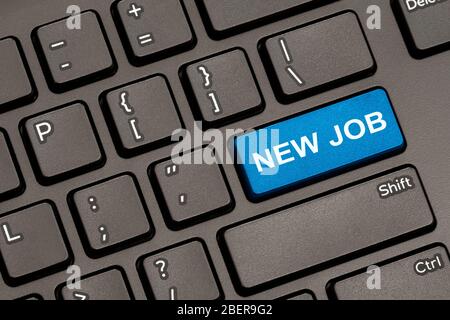 Modern Keyboard with Hot Key for New Job. New Job Concept: Computer Keyboard with New Job on Blue Enter Button. Stock Photo