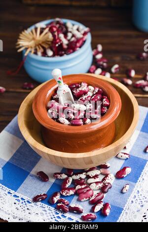Violet with dots beans in ceramic bowl. Swallow beans. Vegetables for healthy eating. Organic food. Stock Photo