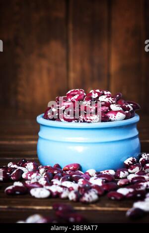 Violet with dots beans in ceramic bowl. Swallow beans. Vegetables for healthy eating. Organic food. Stock Photo