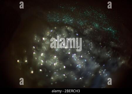 abstract background composed of silver and blue bokeh Stock Photo