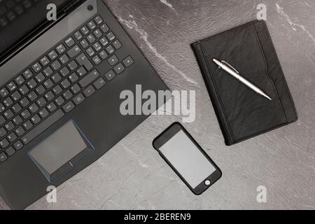 Home workspace with blank smartphone screen Stock Photo
