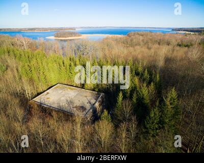 Aerial view of reinforced concrete bunkers belonged to Headquarters of German Land Forces from ww2 hidden in a forest on the Mamry Lake shore, Mamerki Stock Photo