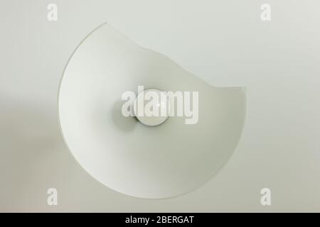 Broken lampshade, the concept of prolonged repair, discord in the family. Stock Photo