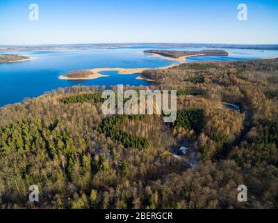 Aerial view of reinforced concrete bunkers belonged to Headquarters of German Land Forces from ww2 hidden in a forest on the Mamry Lake shore, Mamerki Stock Photo