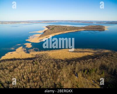 Aerial view of reinforced concrete bunker belonged to Headquarters of German Land Forces from ww2 hidden in a forest on the Mamry Lake shore, Mamerki, Stock Photo