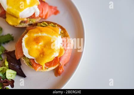 Poached eggs over the toast with smoked salmon. Stock Photo