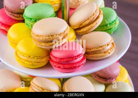 Traditional French Macaroons  in various colors on the plate Stock Photo