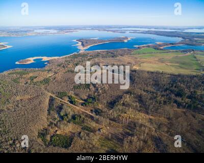 Aerial view of reinforced concrete bunkers belonged to Headquarters of German Land Forces from ww2 hidden in a forest in spring season in Mamerki, Pol Stock Photo