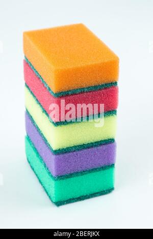 Multicolored sponges for washing dishes on white isolated background Stock Photo