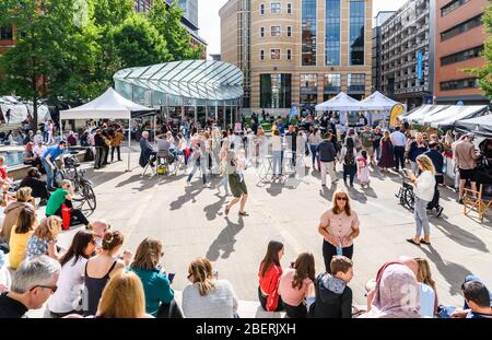 A busy and crowded Brindleyplace in Birmingham City Centre during a summer food and drink festival Stock Photo