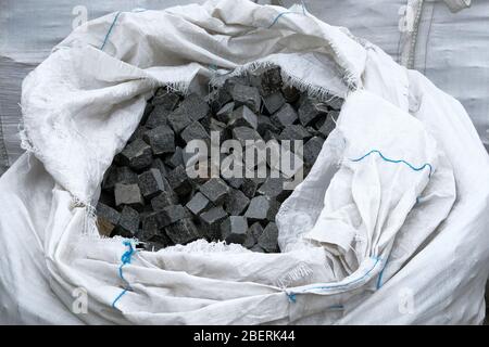 Granite stones are sold in construction market. Construction Materials. Bricks for decoration and construction. Close up. Stock Photo