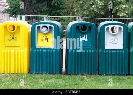 Waste recycling concept. Containers for metal, glass, paper, plastic for further processing of garbage. Separate garbage collection. Stock Photo