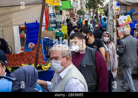 April 14, 2020: Zeytinburnu municipal officers give medical mask to prevent people from coronavirus at street market on April 14, 2020, in Zeytinburnu district, Istanbul, Turkey. On March 27, 2020, the Ministry of the Interior issued an additional circular on market places as part of struggle the coronavirus outbreak. Accordingly, the sale of non-essential supplies other than basic food and cleaning agents will not be allowed. Necessary measures will be taken by the municipalities regarding hygiene and disinfection in the market places. (Credit Image: © Tolga Ildun/ZUMA Wire) Stock Photo