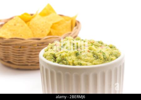 Pile of Tortillas. Nachos chips with guacamole isolated on white background Stock Photo