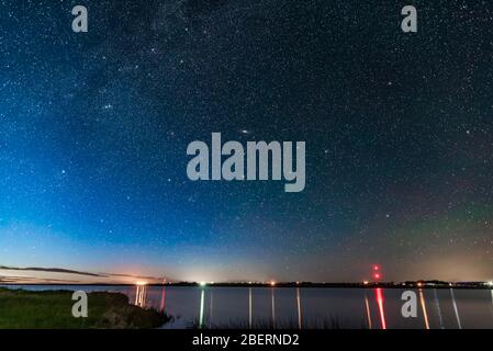 Andromeda Galaxy rising over McGregor Lake in southern Alberta, Canada. Stock Photo