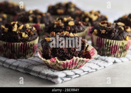 walnut muffins with one eaten Stock Photo
