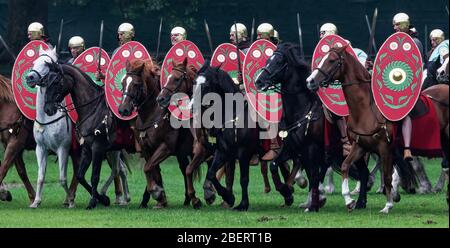 Roman cavalry troops during Turma: Hadrian's Cavalry Charge - a historical reenactment at Bitts Park in Carlisle, Cumbria in 2017 Stock Photo