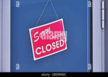 Signboard with inscription SORRY WE ARE CLOSED on glass closed-door, closeup. Job loss concept. Unemployment during coronavirus Covid-19 crisis Stock Photo