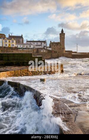 Stormy sea breaching over the harbour wall at Porthleven Stock Photo