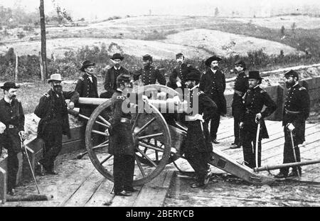 US Civil War -- Major-General William Tecumseh Sherman and his staff on July 19, 1864, at Union Fort #7, during the siege of Atlanta. Sherman is leaning on the cannon's breech. After his capture of Atlanta, Sherman swept through Georgia, destroying everything of value to the Confederacy, thereby seriously weakening the Southern army's supporting supplies system.   To see my Civil War-related images, Search:  Prestor  vintage  Civil War Stock Photo