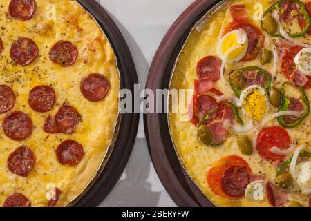 Traditional Calabresa and Portuguese pizza with fresh ingredients Stock Photo