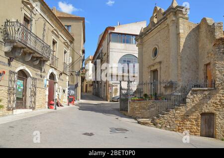 A narrow street between the old houses of Acerenza, a rural village in the Basilicata region, Italy Stock Photo