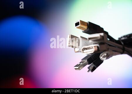 A lot of usb wires. A bunch of wires on a colored background. Stock Photo