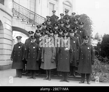 The White House police detail standing in rows on the south portico, 1923. Stock Photo