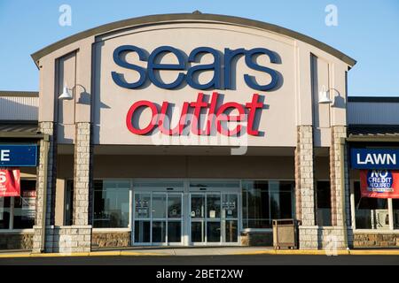 A logo sign outside of a Sears Outlet retail store location in Newark, Delaware on April 11, 2020. Stock Photo