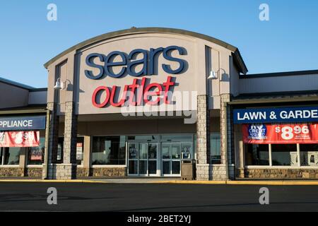 A logo sign outside of a Sears Outlet retail store location in Newark, Delaware on April 11, 2020. Stock Photo