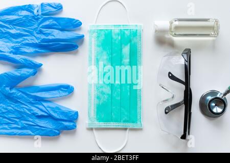 Doctors and nurses protection kit on a lue background, top view Stock Photo