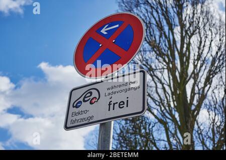 Berlin, Germany - March 11, 2020: View to an street sign that allows the parking of electric cars at a public charging station. Stock Photo