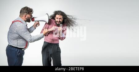 Plump, angry boss yelling at the employee Stock Photo
