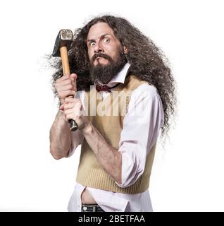 Portrait of an eccentric, aggresive nerd holding a hammer Stock Photo